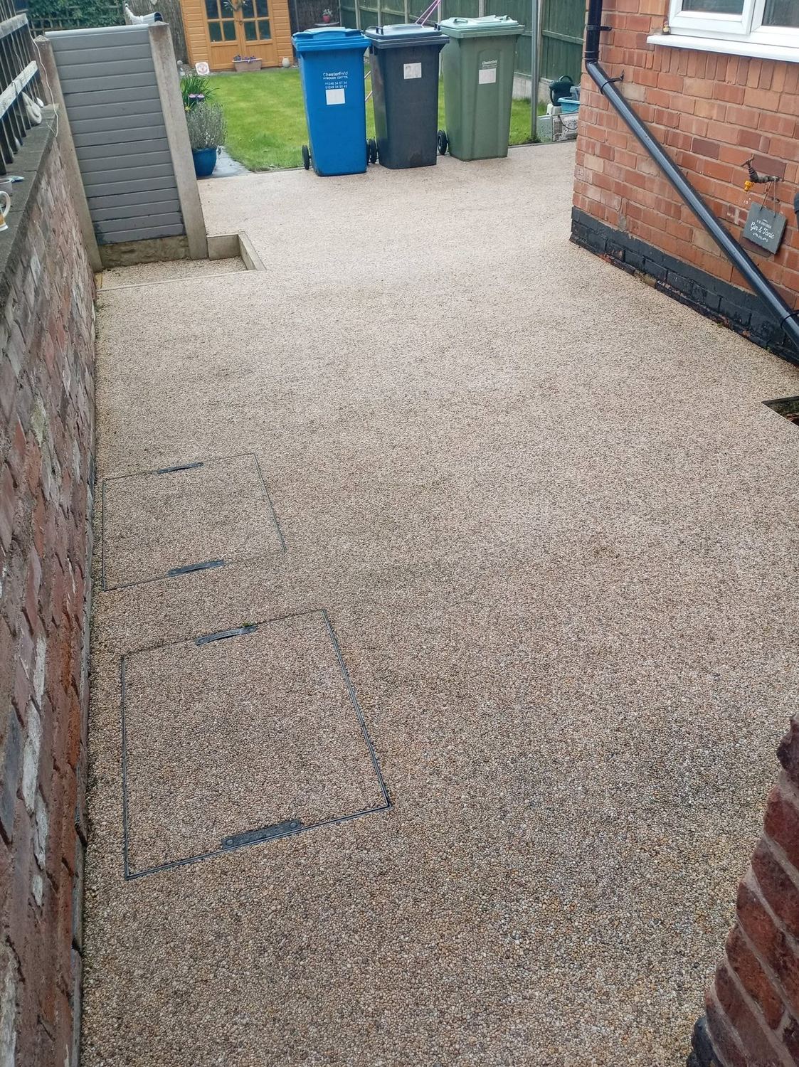 Clean golden resin driveway after professional jet washing